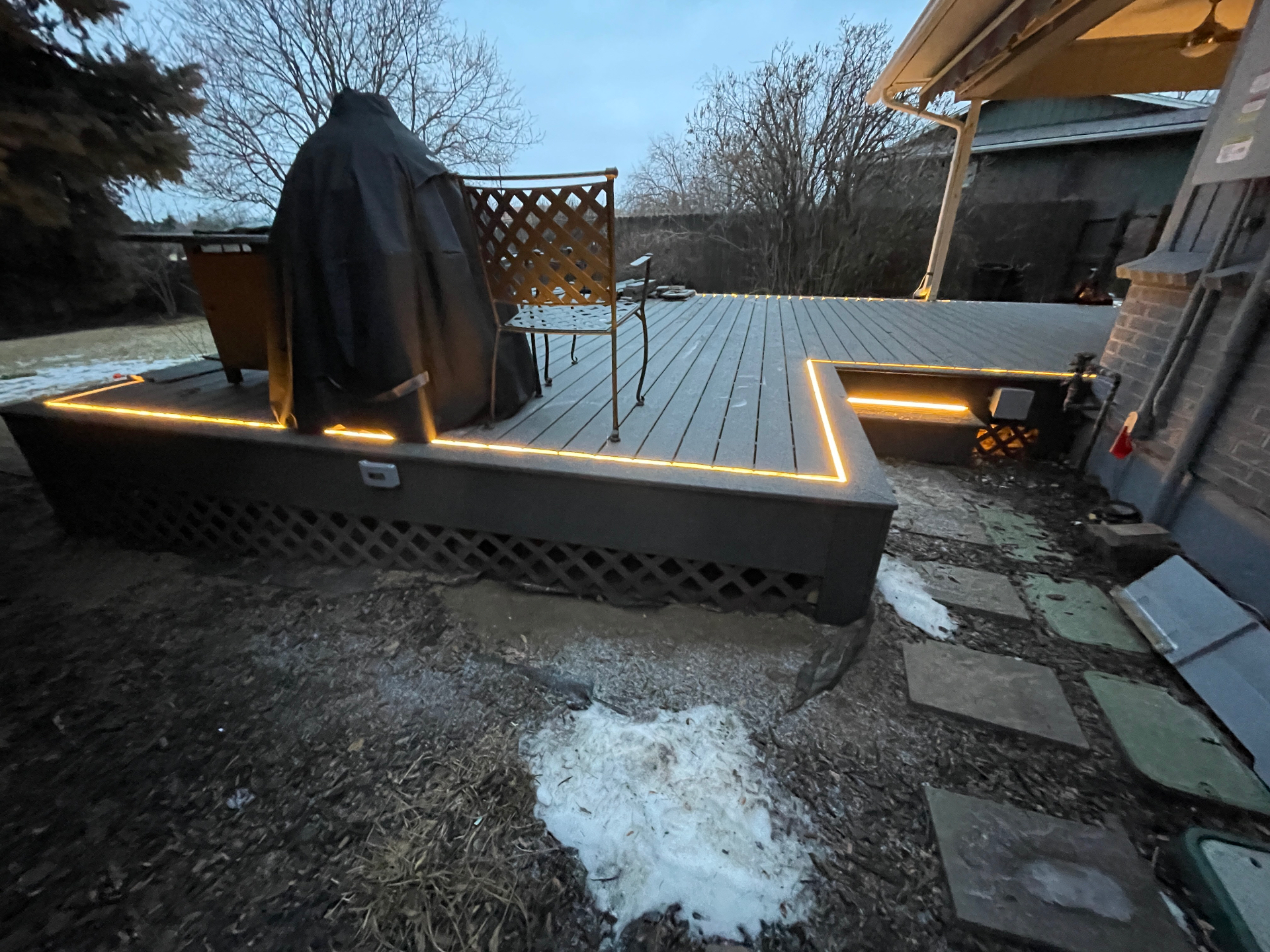 Finished deck with integrated LED lighting at twilight